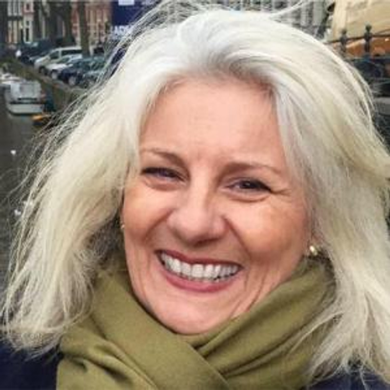 head shot smiling woman with fair hair
