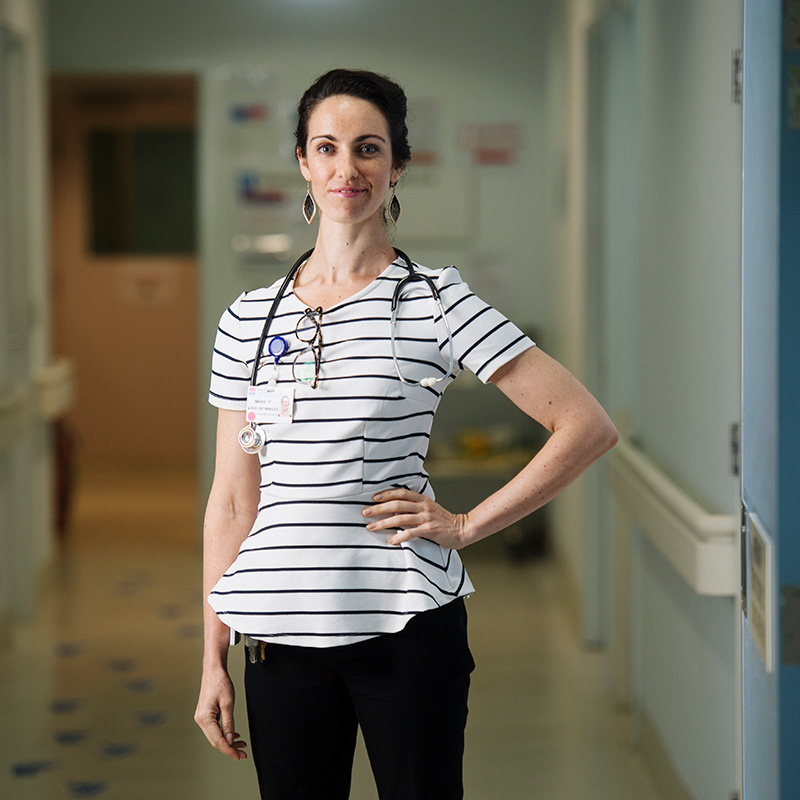 Southern Cross University nursing graduate Inkah Fischer standing at workplace