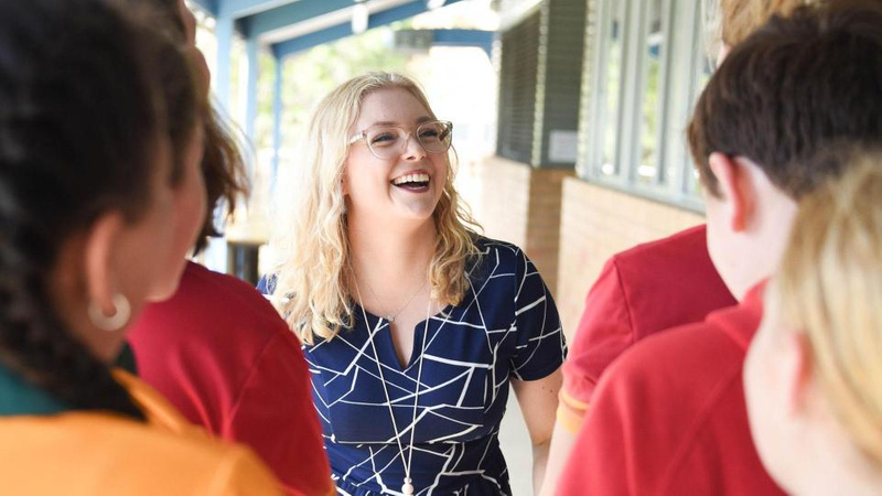 Happy teacher with students