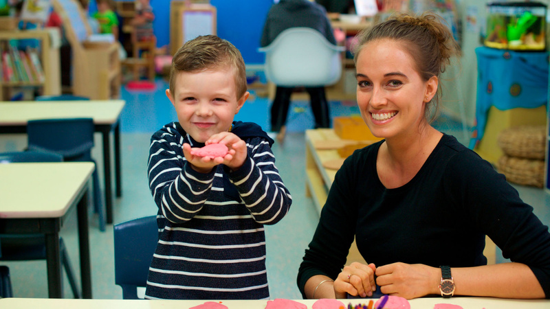 Child with teacher in an early childhood class