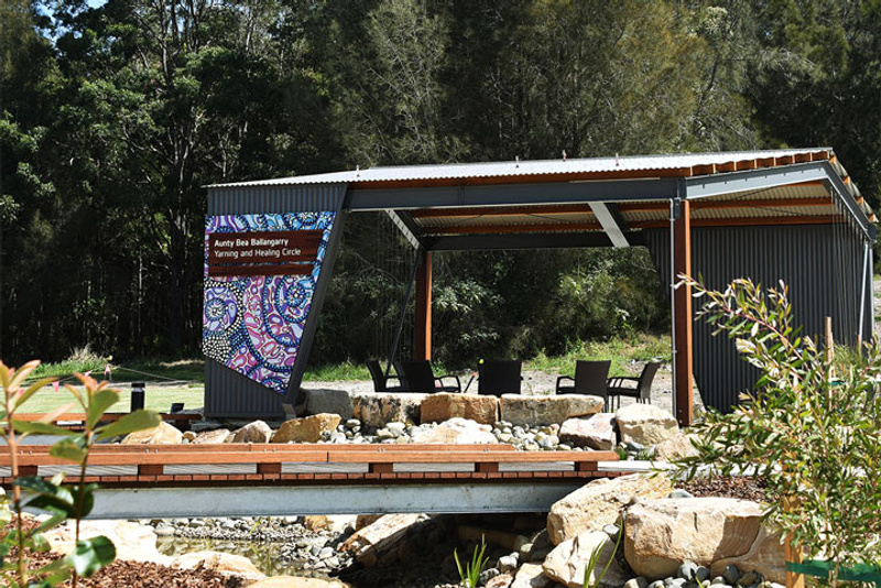 Open area with indigenous artwork on structure