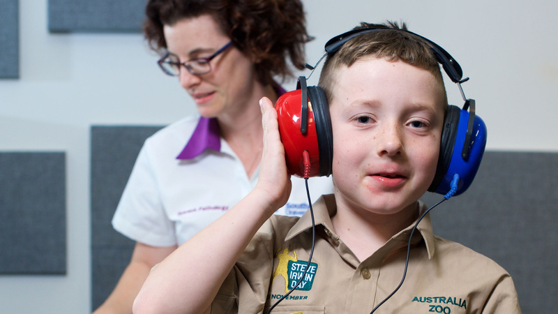 Young boy undergoing auditory testing at the Speech and Pathology lab, Gold Coast