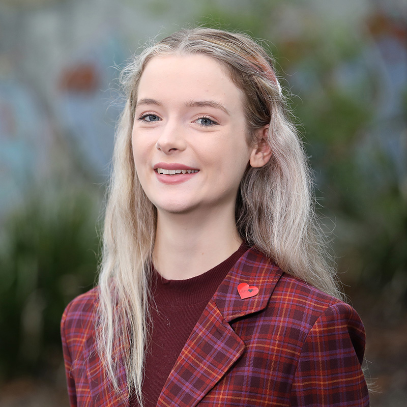 Kashmir Miller - image shows young woman wearing red checked jacket