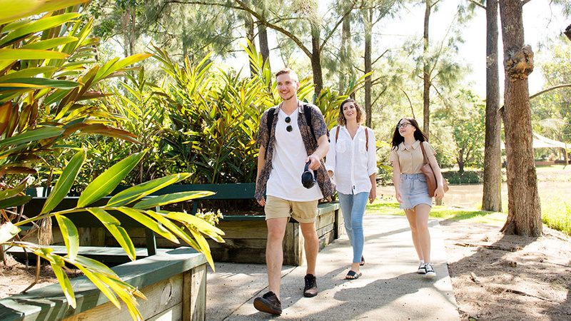 Download our Going to Uni guide for helpful advice to parents and caregivers - image shows three students walking at Lismore campus
