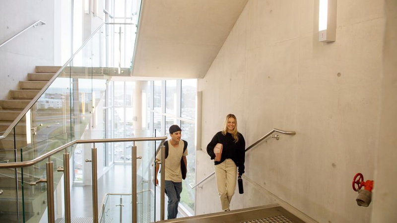 students on campus walking up stairs - Special Admission Schemes