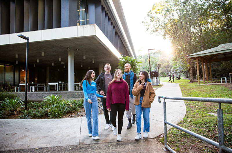 A group of students walking through Lismore campus