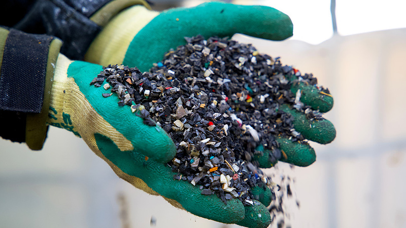 Waste Management in the Circular Economy - image shows plastic waste in gloved hand