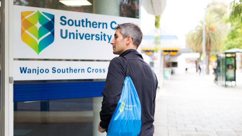 Student entering Perth campus building