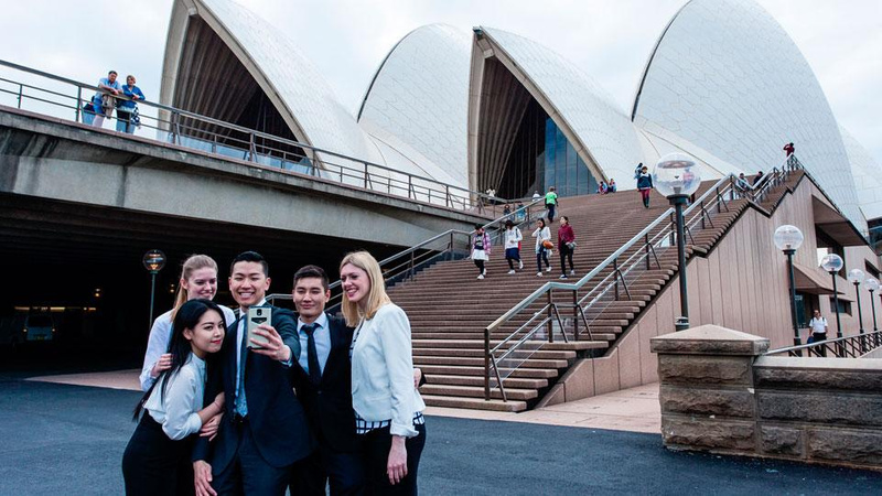 Students standing in front of the Opera House