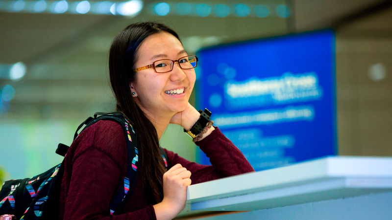 Female student smiling at camera